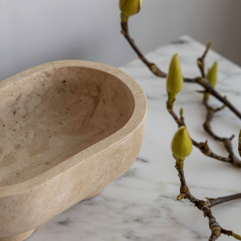 The Muse footed oval tray in Beige Travertine with elegant design, inspired by Greek artistry, perfect for upscale decor and thoughtful display in luxury interiors