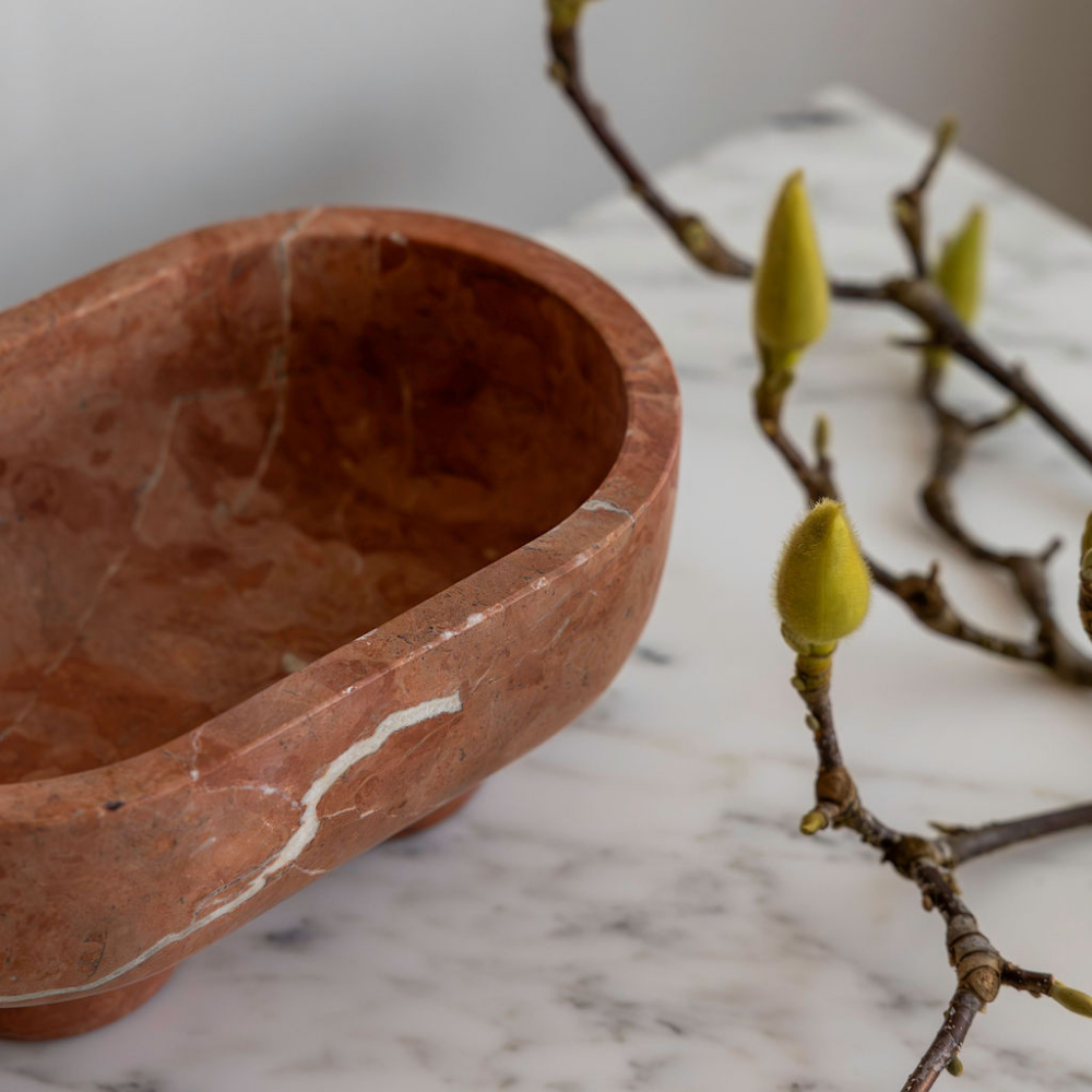 The Muse footed oval tray in Rosso Alicante with elegant design, inspired by Greek artistry, perfect for upscale decor and thoughtful display in luxury interiors