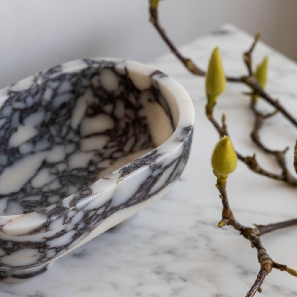 The Muse footed oval tray in Viola Calacatta with elegant design, inspired by Greek artistry, perfect for upscale decor and thoughtful display in luxury interiors