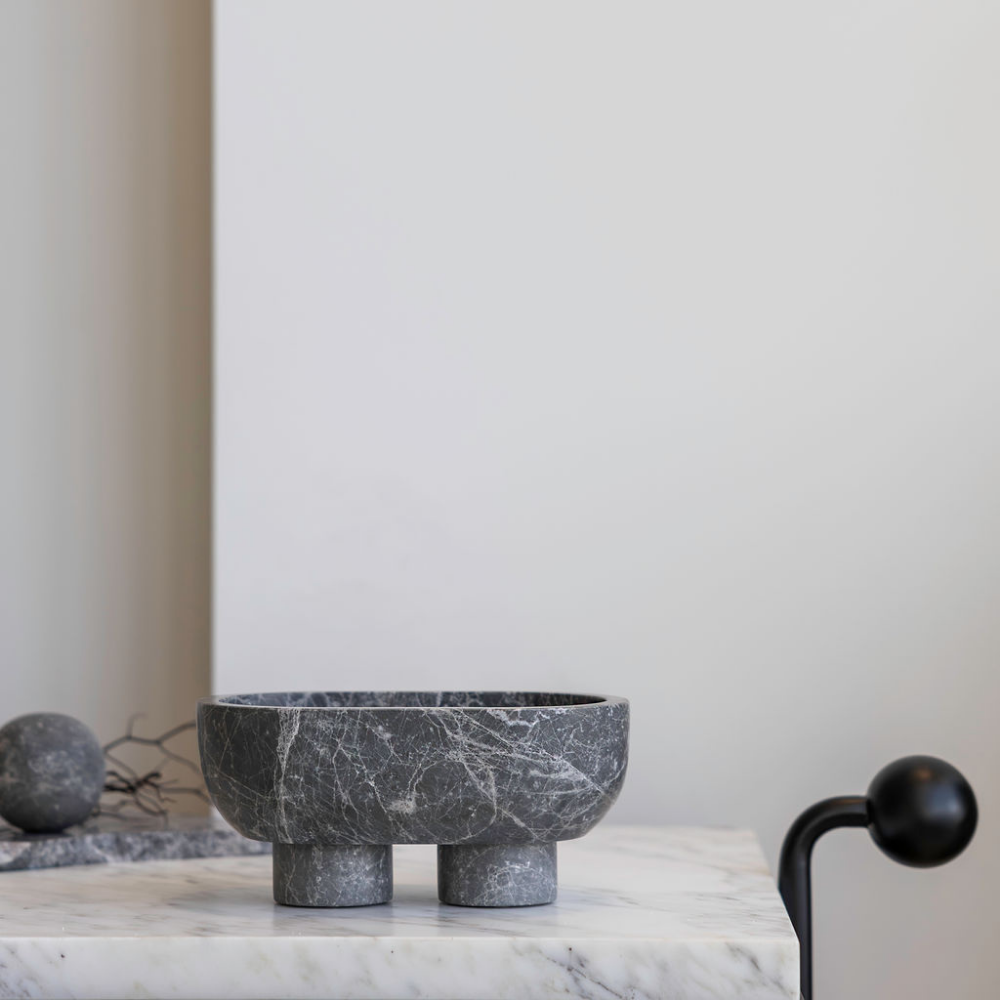 The Muse footed oval tray in Tundra Grey with elegant design, inspired by Greek artistry, perfect for upscale decor and thoughtful display in luxury interiors