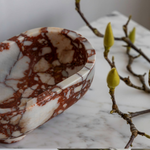 The Muse footed oval tray in Brown Calacatta with elegant design, inspired by Greek artistry, perfect for upscale decor and thoughtful display in luxury interiors